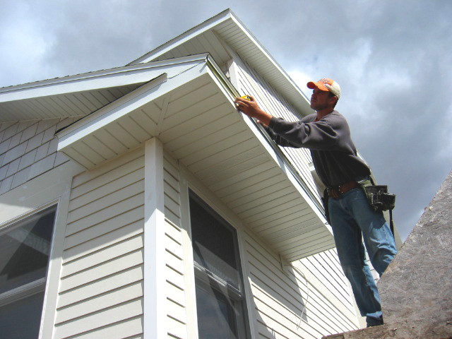 Installing gutters on home